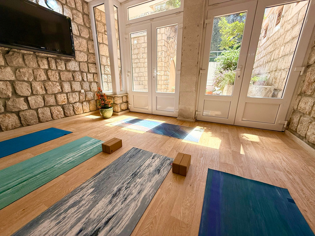 Yoga practice in the stone-walled shala